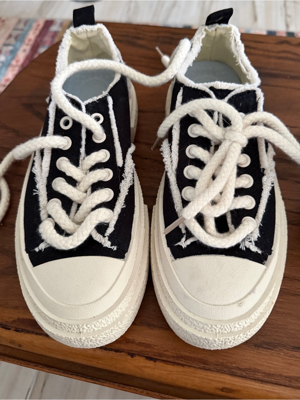 Low-Top Black Canvas Sneakers with Cream Soles and Frayed Trim